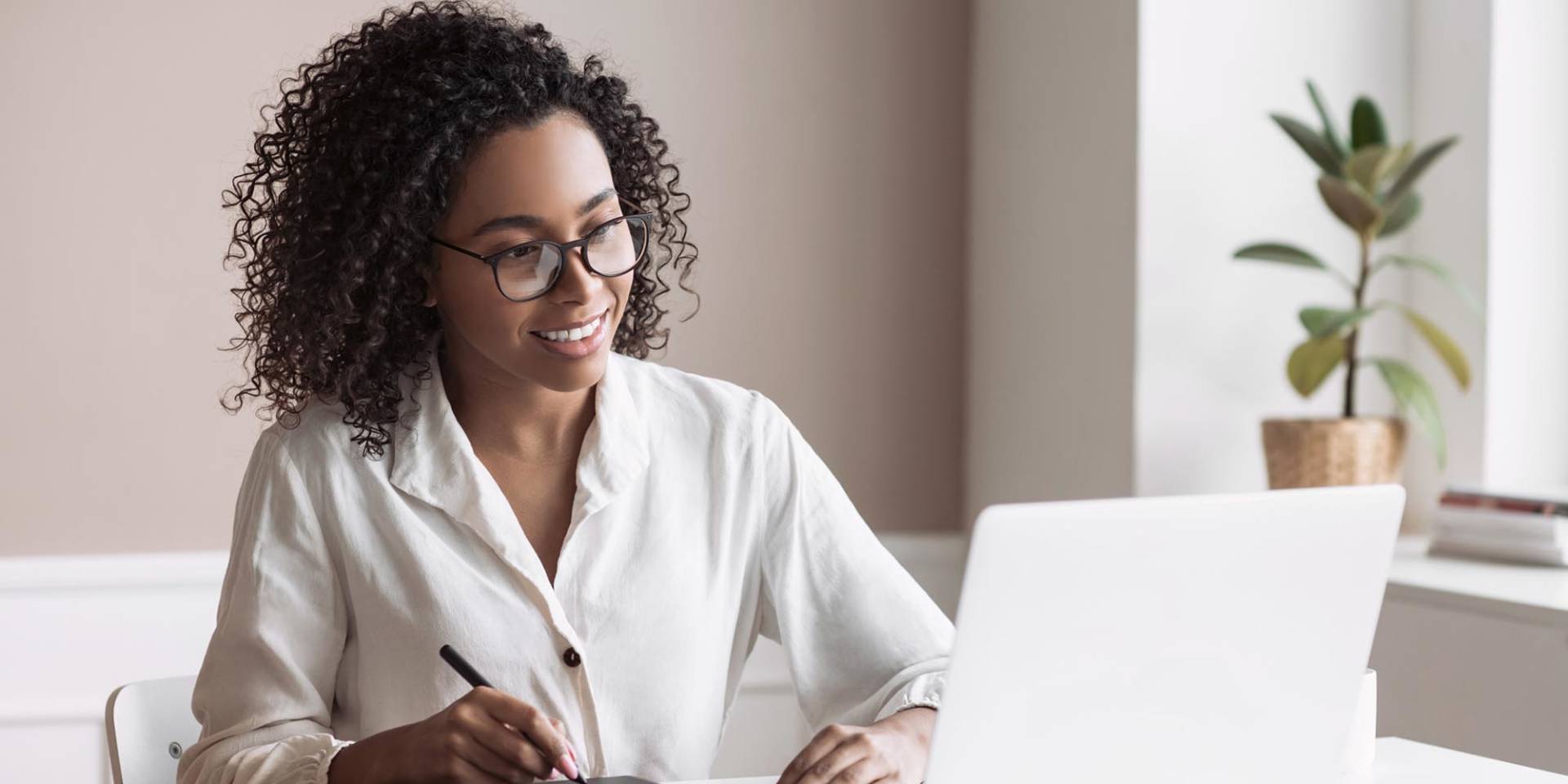 Marketing professional working from laptop.