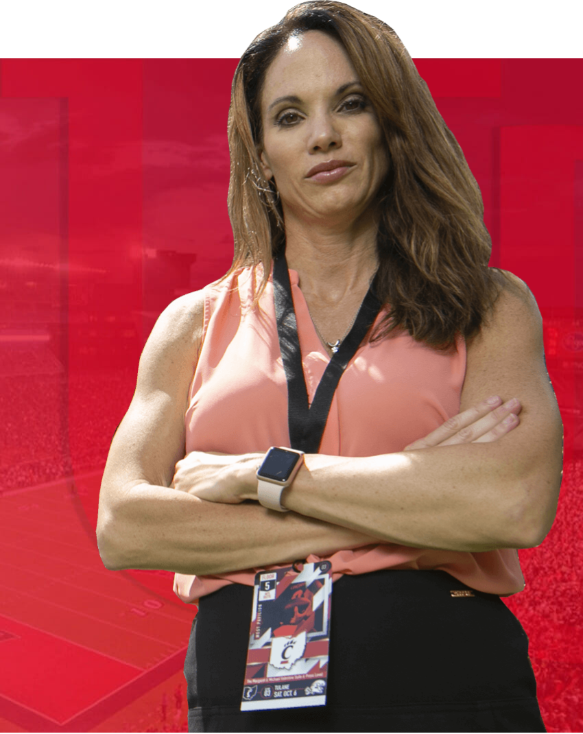 UC Sports administration Student standing with crossed arms.