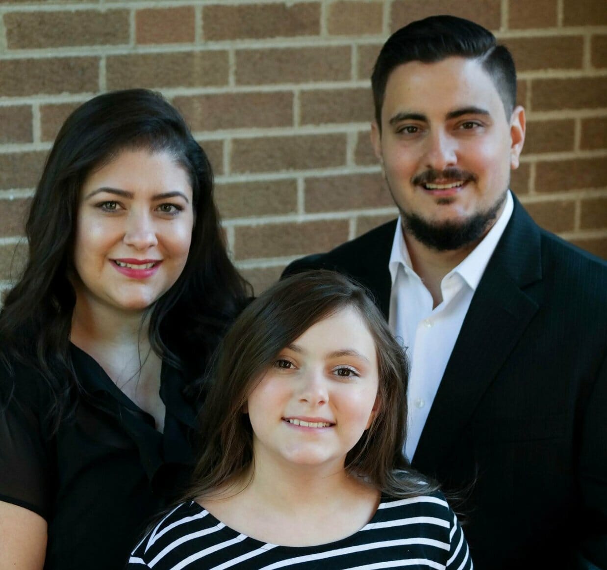 Portrait of Ana B. with her husband and daughter