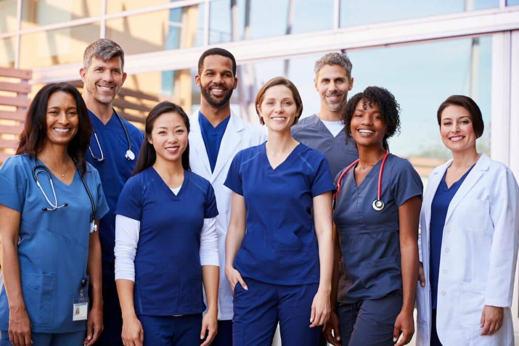 Health Informatics students facing camera smiling.