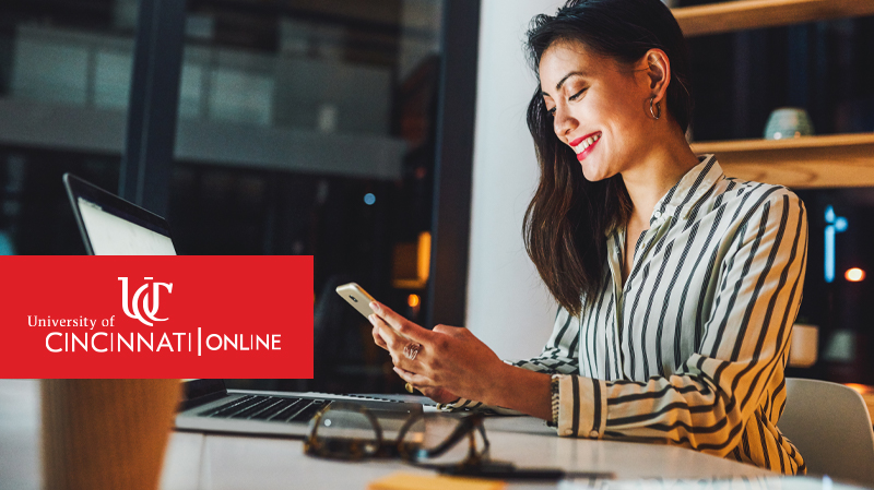 Online student looking at mobile phone