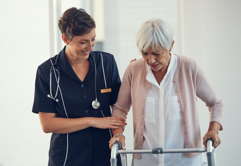 doctor helping patient walk