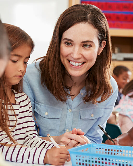 teacher smiling at students