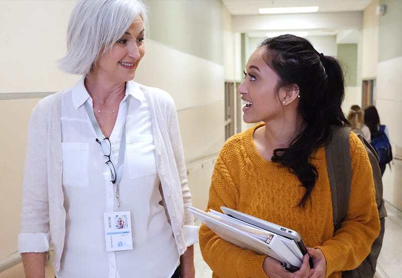 student talking to professor