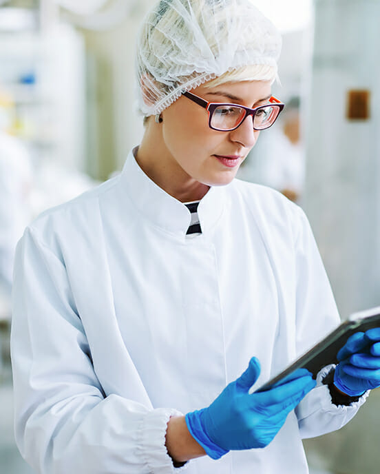 woman looking at tablet