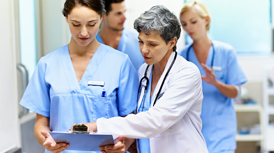 Nurse and doctor going over paperwork