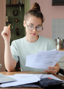 Accounting Student reading papers
