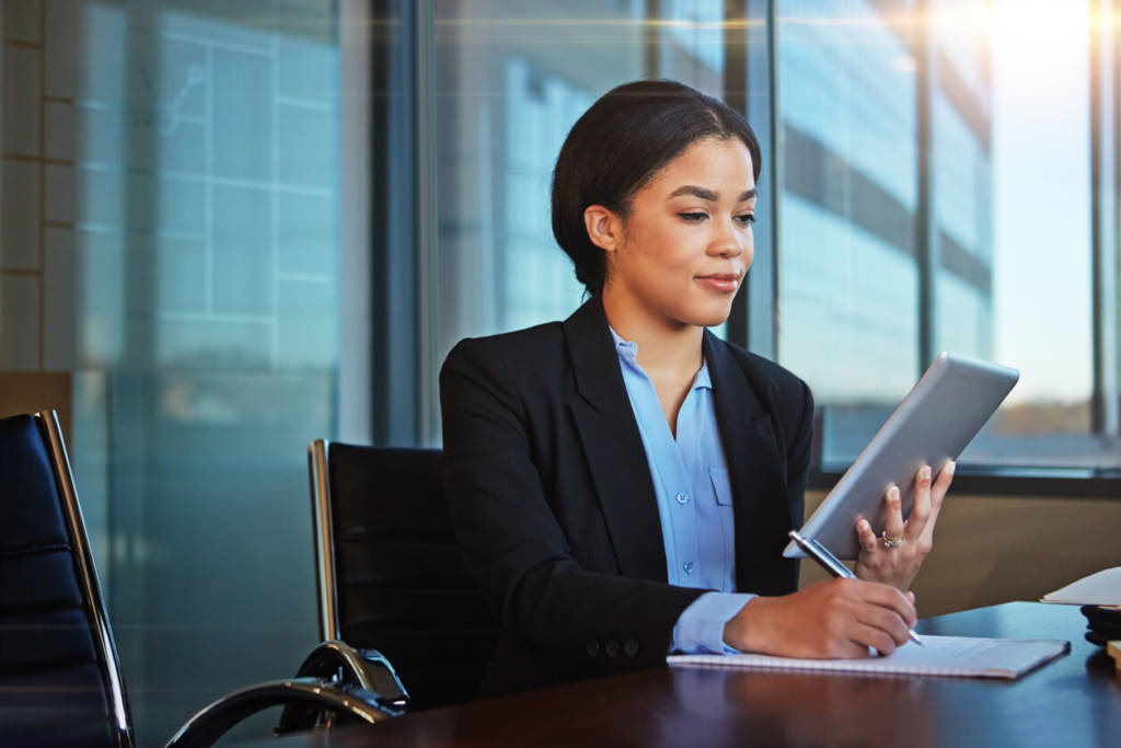 Businesswomen taking notes