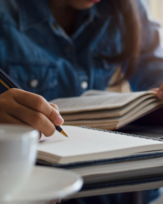 lady studying coffee cup
