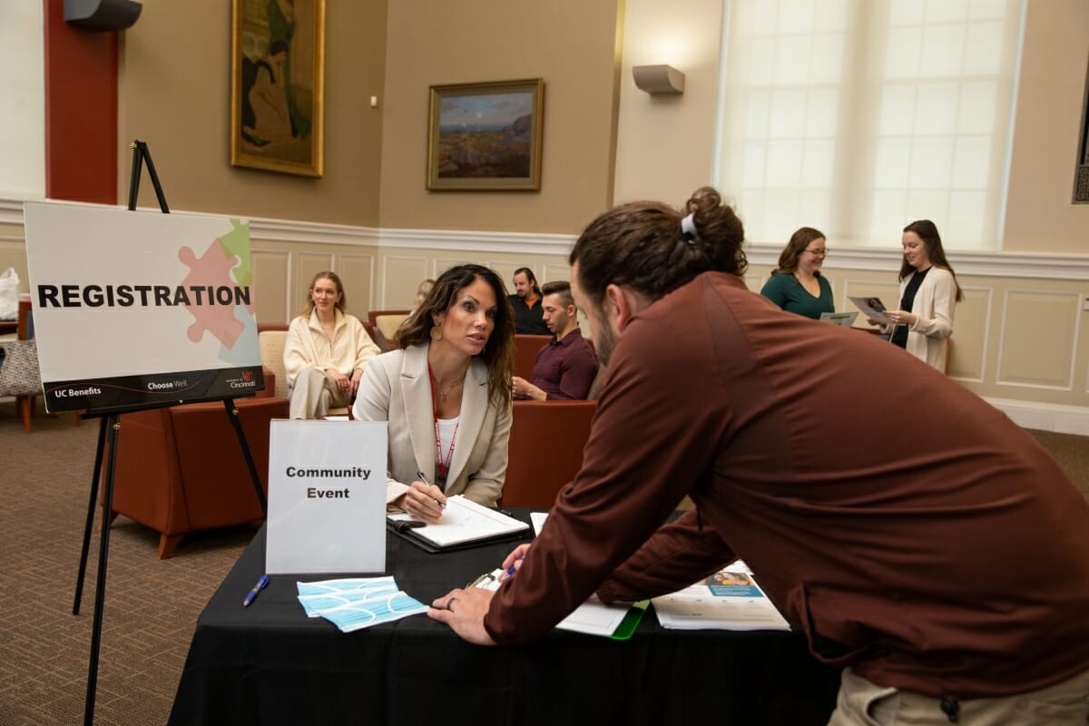 Man signing into a public health community event