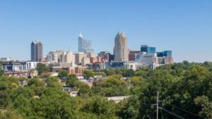 Photo of Raleigh, NC with trees in the foreground