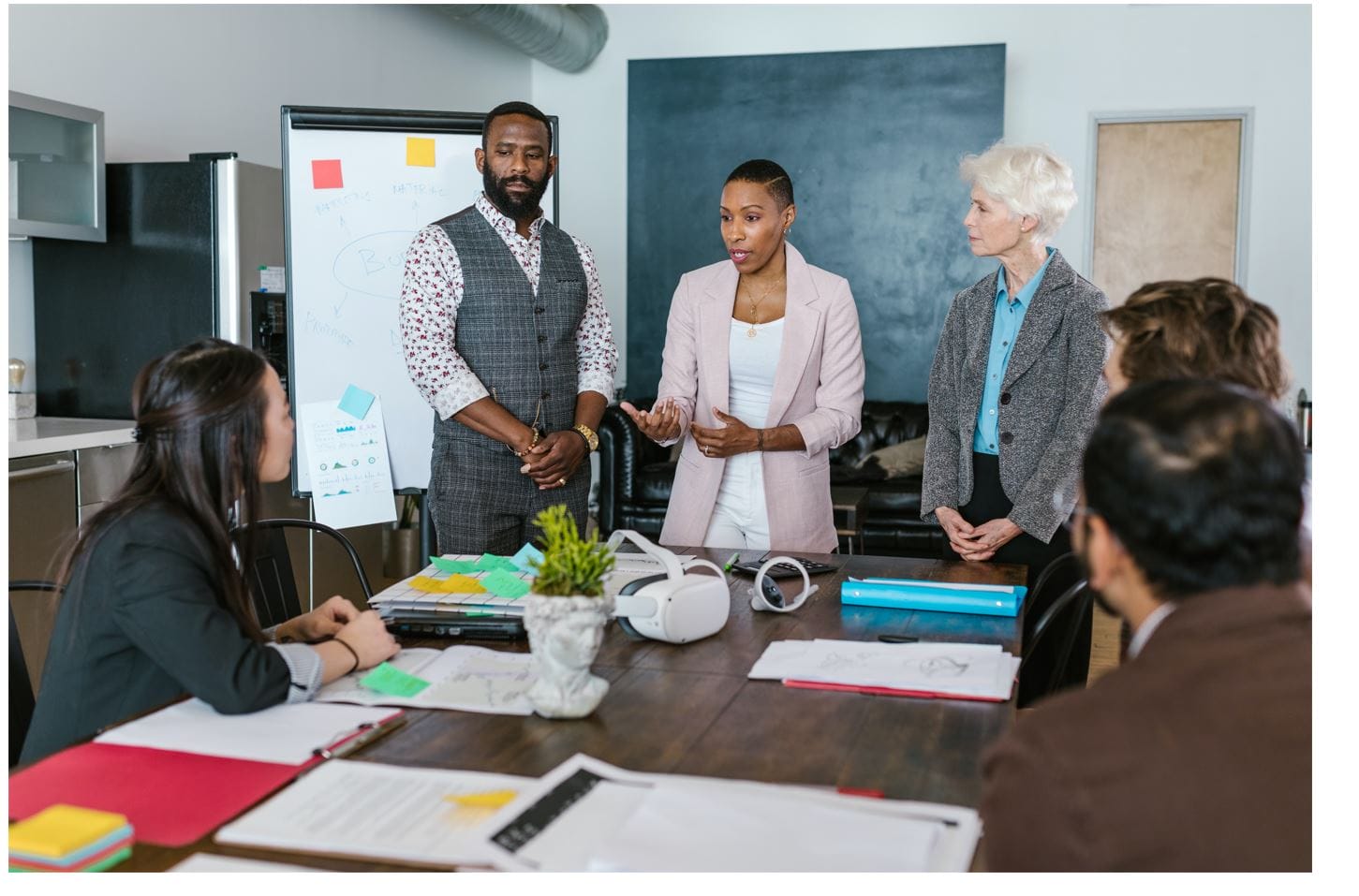Leader of an organization having discussion with her team