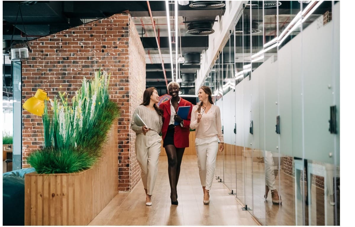 Organizational leadership degree graduates walking in the office