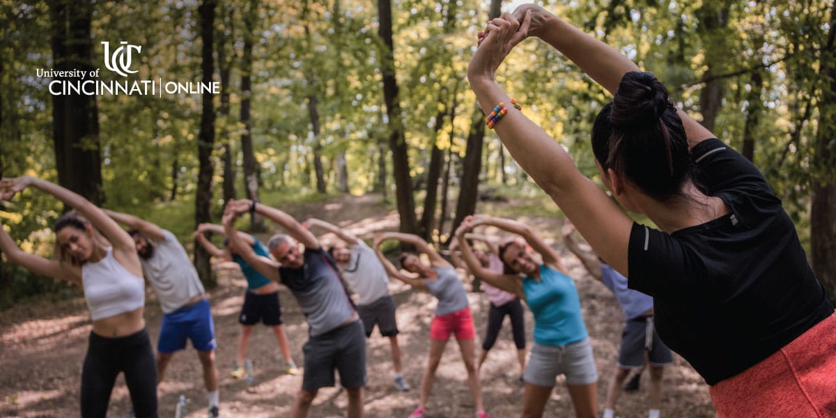 Health and wellness graduate leading a yoga class