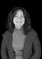 A black and white portrait of Carla Chifos.