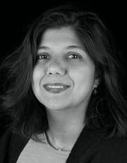 A black and white portrait of Shilpa Mehta.